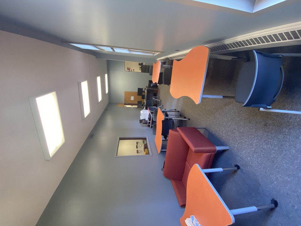 Appleby Hall 140, the main checkin area for the MCAE suite. This space features many spaces to sit and study, as well as a student printer for free printing and access to a student kitchen.